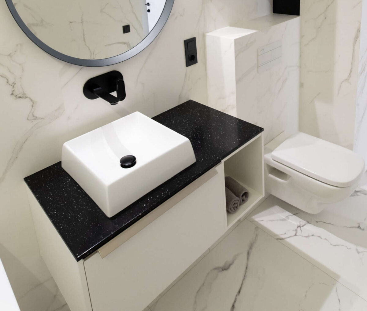 bathroom -with-marble-tiles-with-a-white-cabinetry.jpg bathroom with marble tiles with a white cabinet and shelves